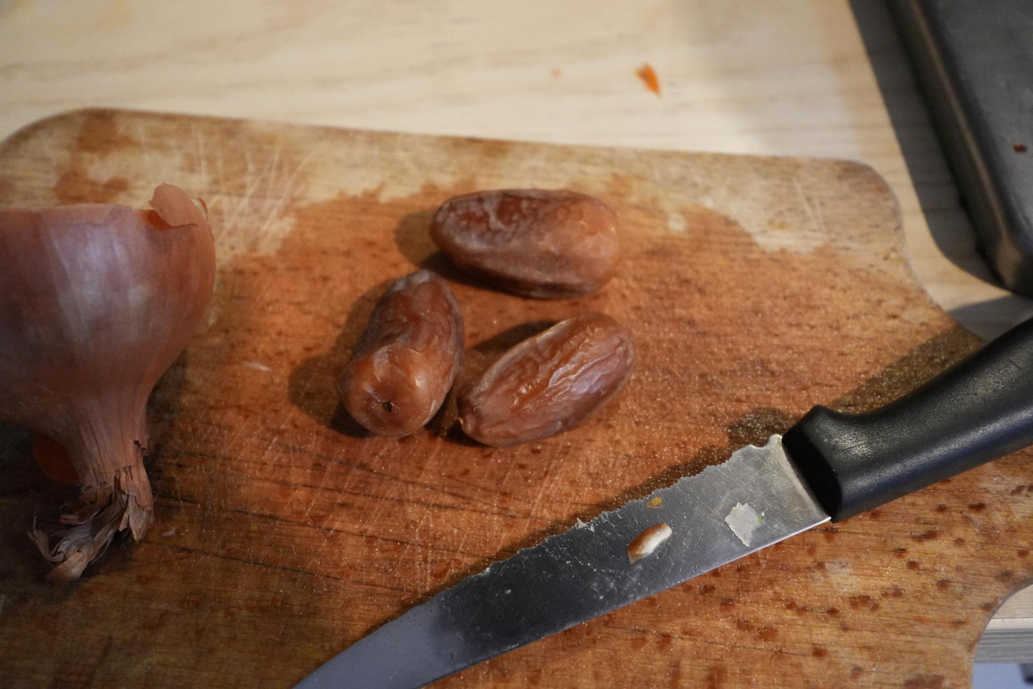 dates on the counter and chopping board