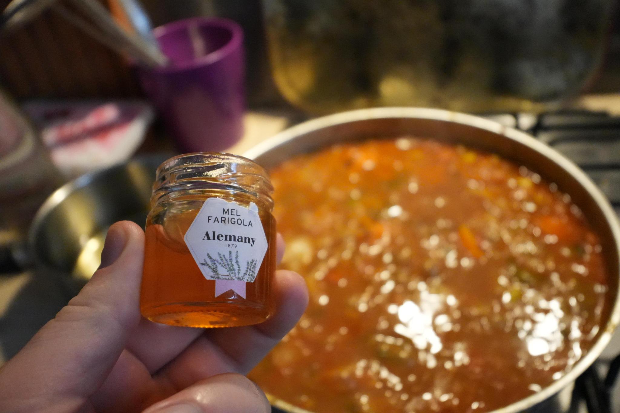 an opened bottle of honey