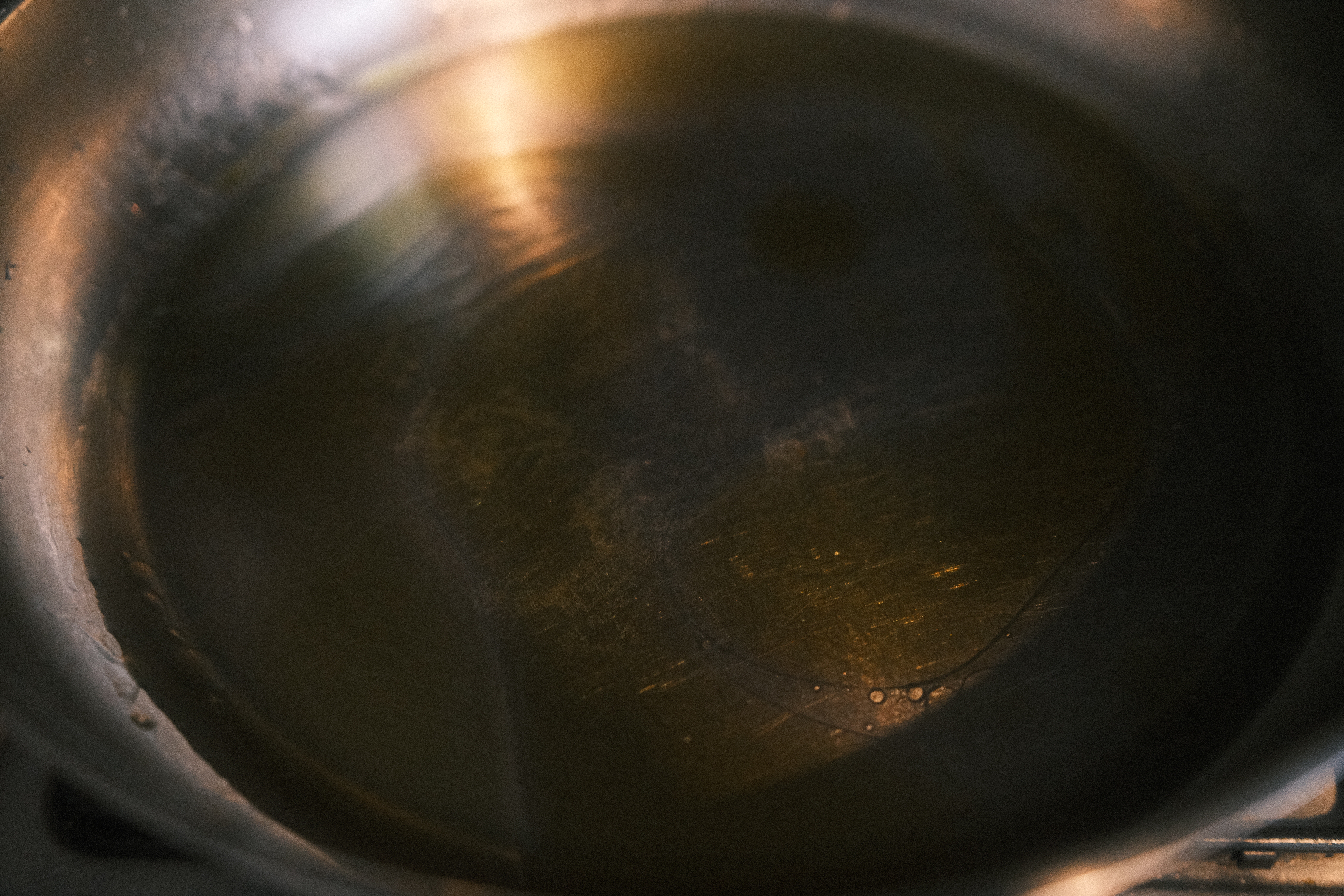 a pan containing water and olive oil
